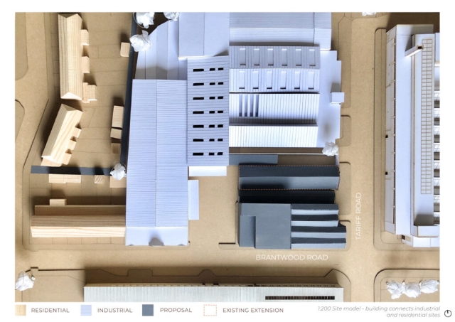 massing model showing the existing industrial buildings in white and the new leatherworks in black. The base is MDF