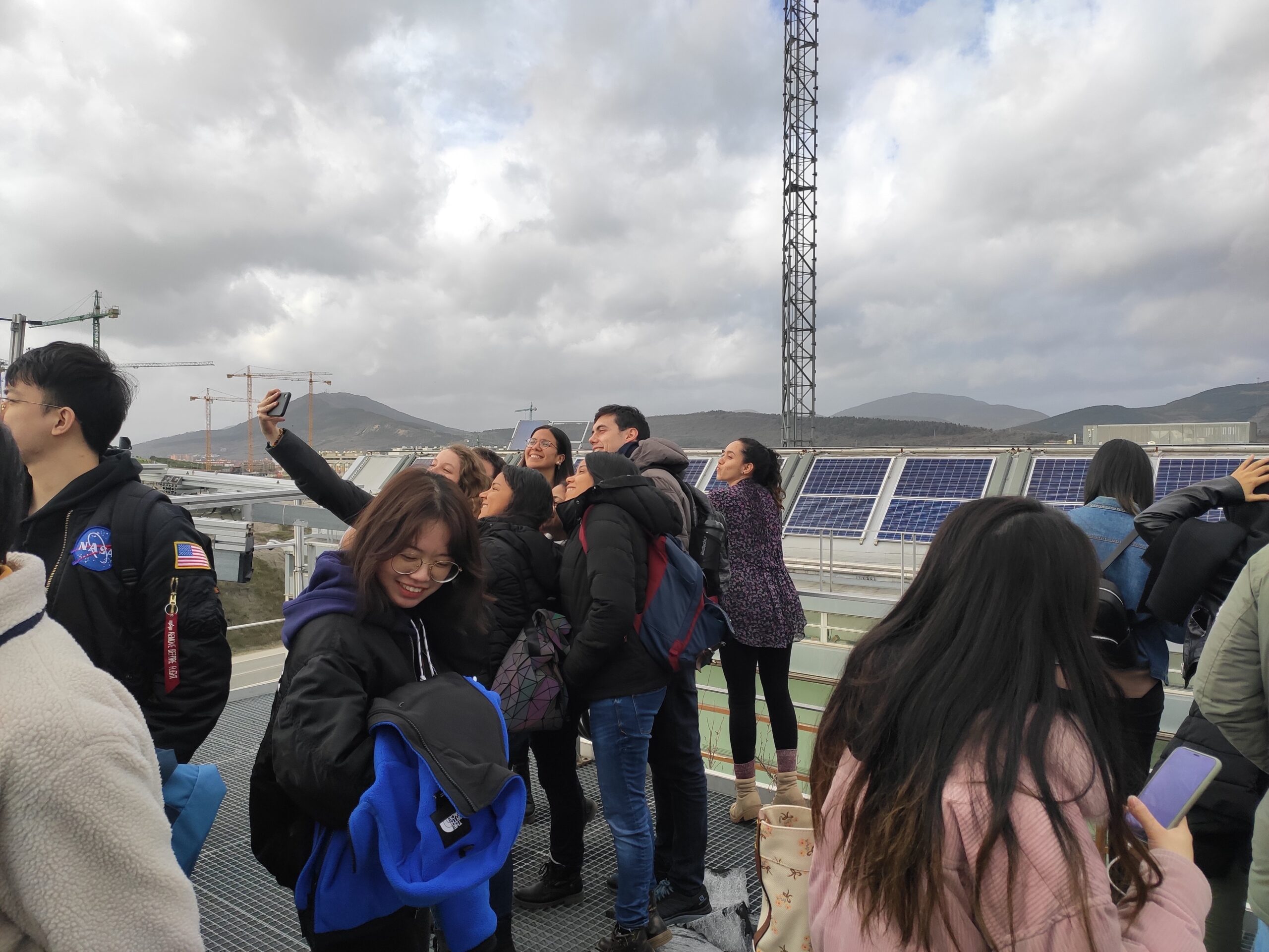 Student looking at PV technology at the roof of the Cener National Renewable Energy Centre building