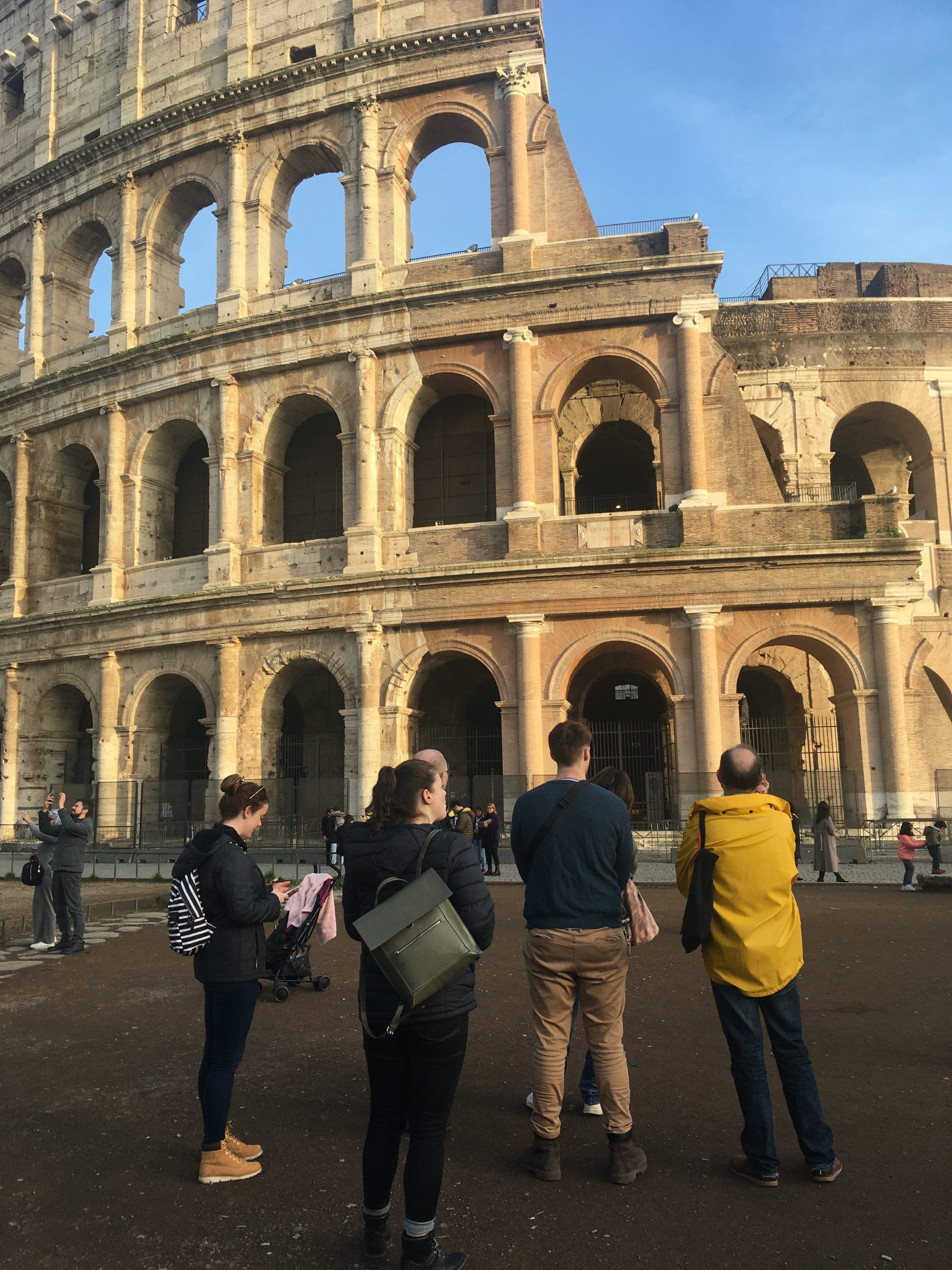 Students and staff contemplating repairs to olosseum, Rome