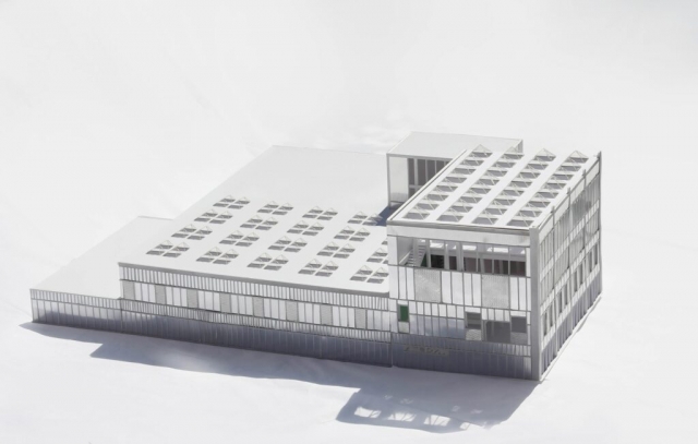 a model of the printworks showing the exterior which is clad of corrugated and perforated metal