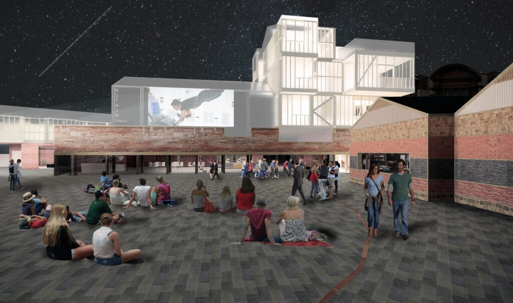 A view towards the proposed scheme from the public realm. This space can be used communally for events and festivals - as the image shows, or as an outdoor cinema.